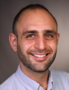 Headshot for Berk Uston, PhD.